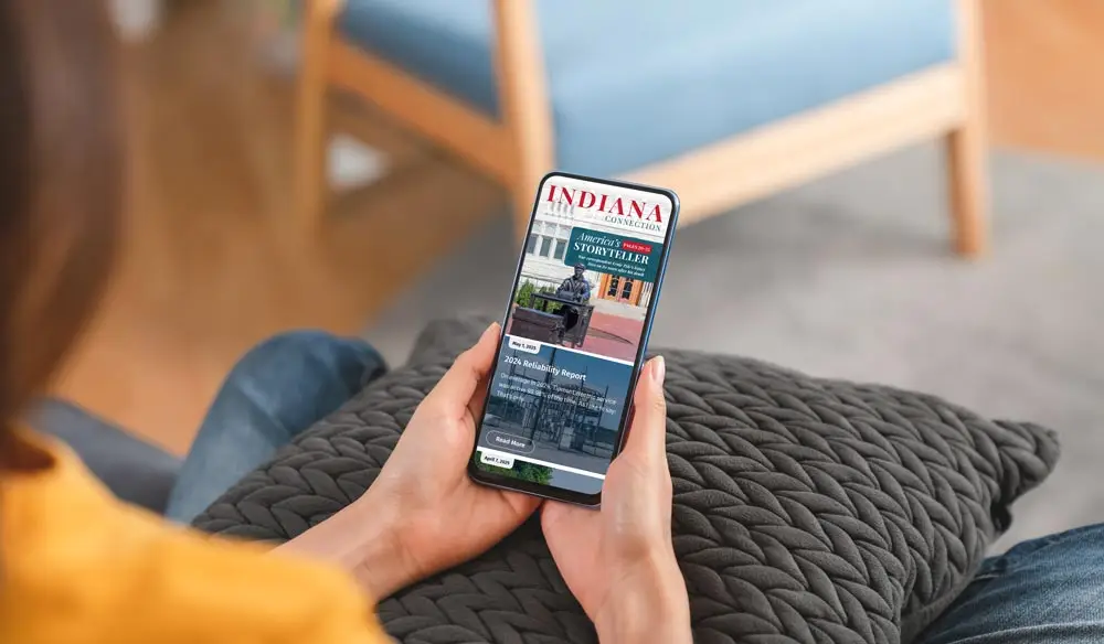 A person reading an email of Indiana Connection on their mobile phone